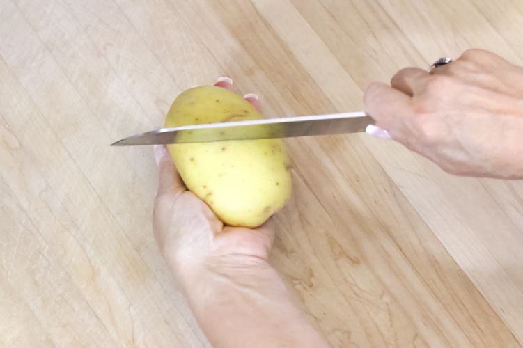 #2 Score the potato skin in different directions to keep skin on.
