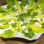 Scalloped white serving platter with Romaine Salad Boats.