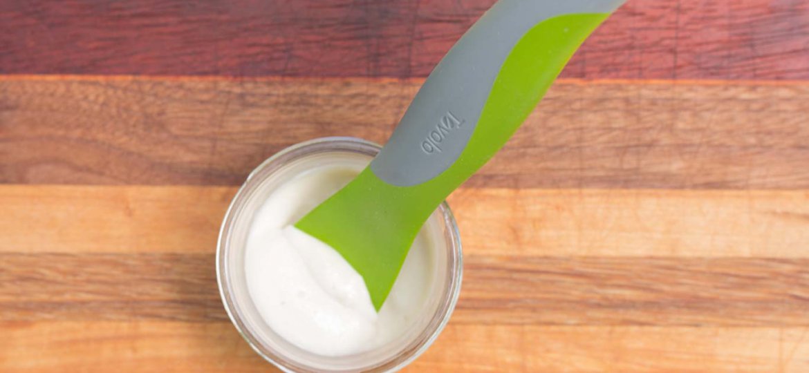 Tovolo Silicone Spatula in a jar containing oil-free vegan maynnaise.