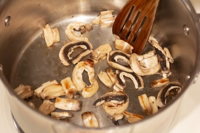 Add about 1/3 of the mushrooms to the pan and allow to brown a little.