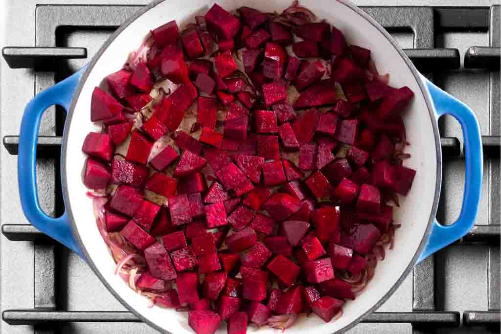 Diced beets added to the braiser pan to caramelize